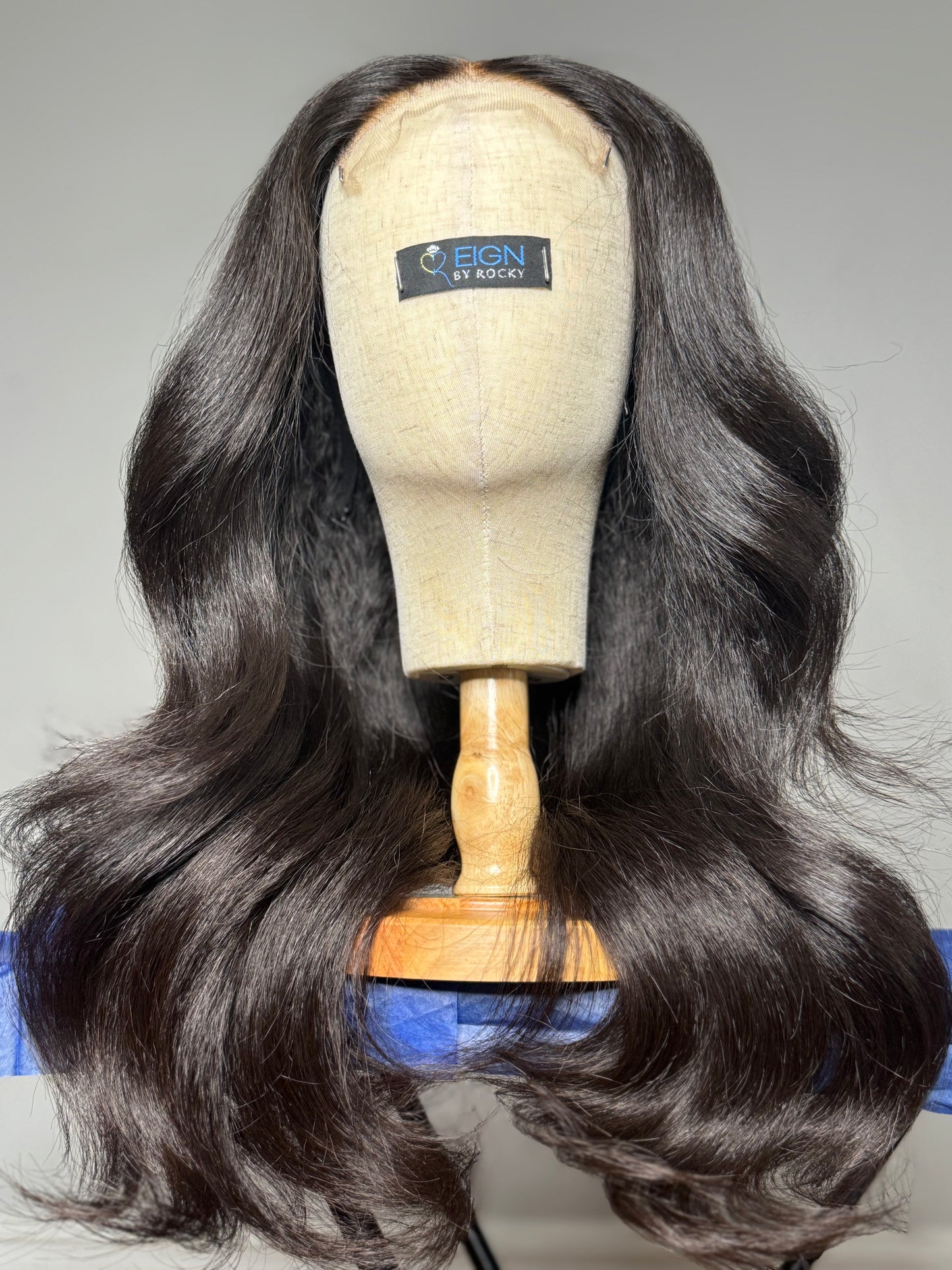 Black kinky straight wig styled with lose curls